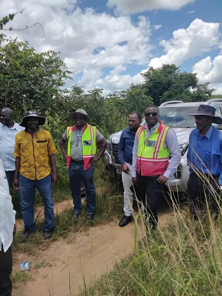 Survey party walking the land earmarked for expansion